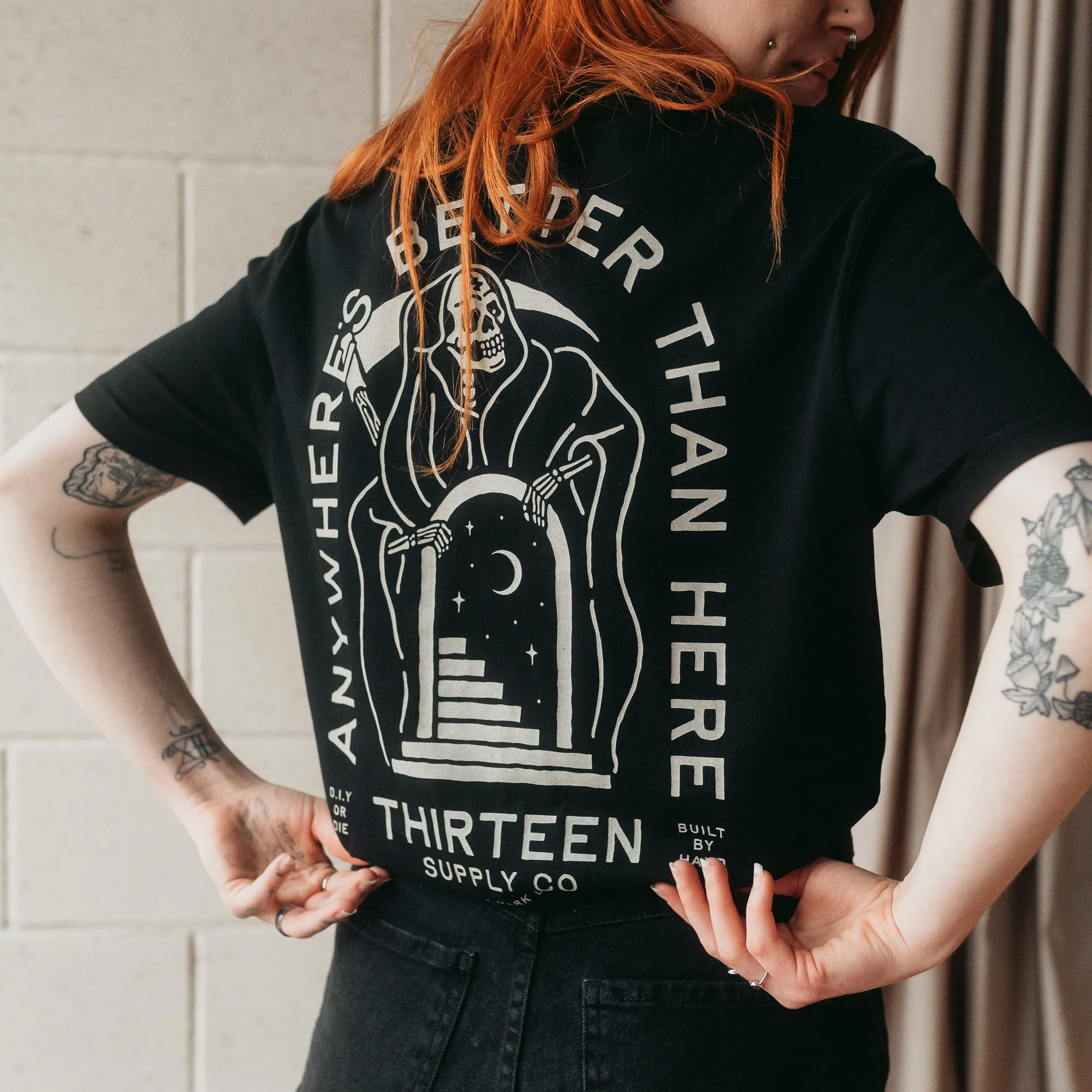 ANYWHERE'S BETTER THAN HERE - BLACK UNISEX T-SHIRT